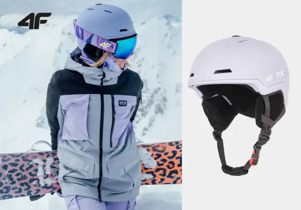 Męski kask narciarski 4F w kolorze liliowym, idealny na stok. Widoczny na zdjęciu z narciarką w kurtce 4F.