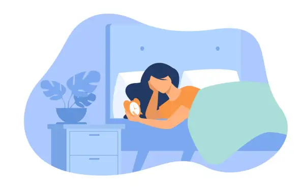 A woman in bed holds an alarm clock, wondering if 6 and a half hours of sleep is enough.