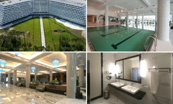 Widok z lotu ptaka na hotel, basen, lobby i łazienkę.