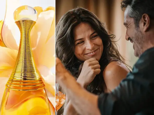 Złota butelka Dior J'adore 100ml obok uśmiechniętej pary.