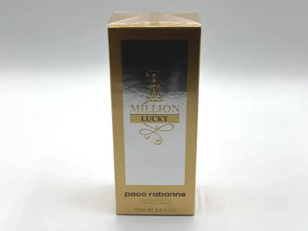 Złote opakowanie Paco Rabanne 1 Million Lucky 100ml z napisem "MILLION LUCKY" i ozdobnymi elementami.