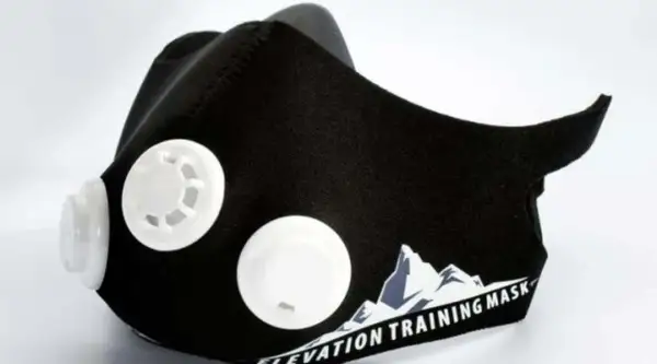 Black training mask with white valves, designed to enhance workout performance. Discover the training mask benefits for your fitness journey.