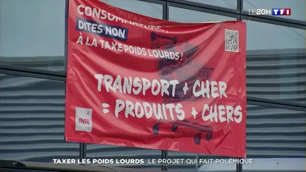 Bannière rouge "Consommateurs, dites non à la taxe poids lourds ! Transport + cher = produits + chers". Document sur la taxe à l'essieu.