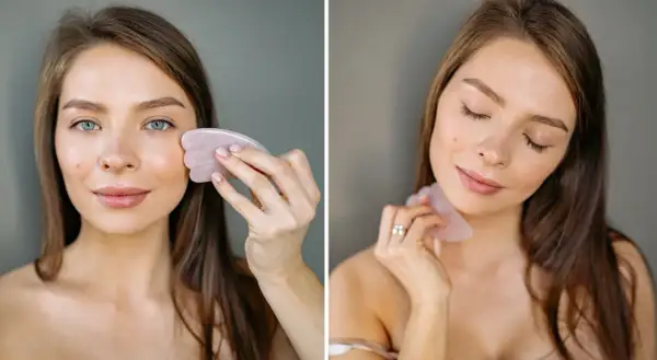 Kvinna använder en gua sha för ansiktsmassage.