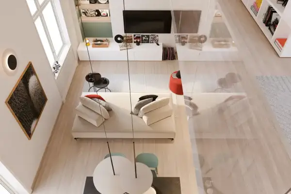 Un angolo di casa moderno e accogliente, perfetto per arredare con stile. Divano bianco, tavolino nero, quadri e giradischi creano un'atmosfera unica.