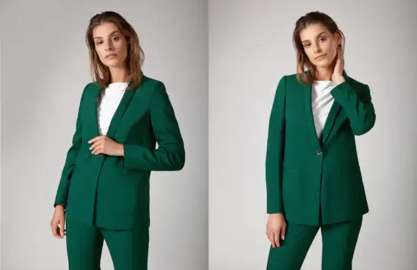 Eleganckie stylizacje biznesowe damskie w odcieniu butelkowej zieleni. Modelka prezentuje zielony garnitur: marynarkę i spodnie.