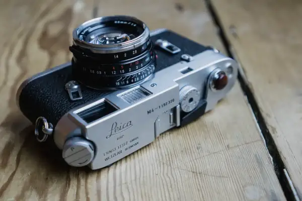 A classic Leica M4 camera with a Summicron 35mm lens, ready for capturing timeless moments.