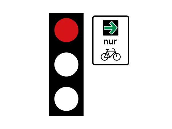Rote Ampel zeigt Stopp an. Ein Schild mit Pfeil nach rechts und Fahrradsymbol bedeutet: Nur Radfahrer dürfen hier weiterfahren. Wer hat Vorfahrt?