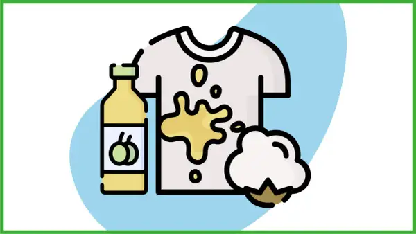 Come togliere macchie di olio dopo lavaggio: una bottiglia di olio, una maglietta macchiata e un batuffolo di cotone.