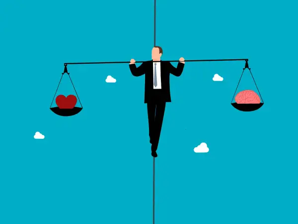 Man balanceert op een koord met een hart en een brein op een weegschaal. Een metafoor voor de balans tussen high sensation seeker en relaties.