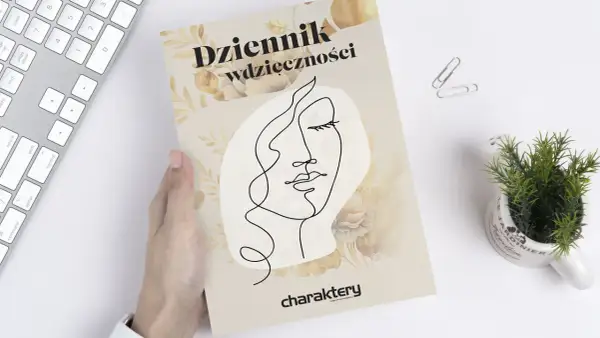 Dziennik wdzięczności z minimalistyczną twarzą i kwiatami. Dowiedz się, jak prowadzić dziennik wdzięczności, by doceniać małe rzeczy.