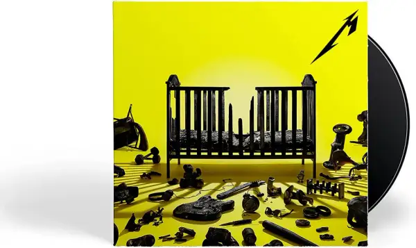 Okładka albumu Metallica "72 Seasons" z czarnymi zabawkami i zniszczonym łóżeczkiem na żółtym tle.