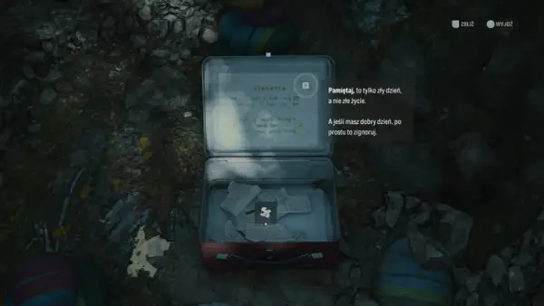 Otwarta metalowa skrzynka z notatkami. Jedna z nich zawiera cytat: "Pamiętaj, to tylko zły dzień, a nie złe życie." To cenna wskazówka w alan wake poradnik.