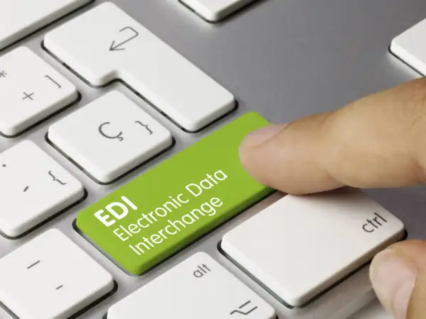 Palec naciska zielony klawisz z napisem EDI Electronic Data Interchange. To skrót od Electronic Data Interchange, czyli elektronicznej wymiany danych.