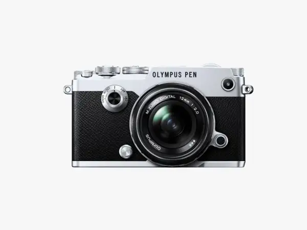 The Olympus PEN-F camera, a stylish blend of retro design and modern technology, ready to capture your next masterpiece.