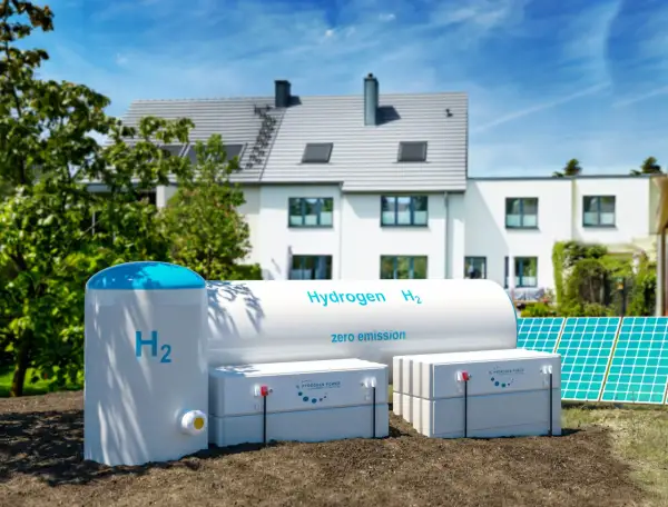 Nowoczesny dom zasilany przez piec na wodór, panele słoneczne i magazyny energii. Czysta energia przyszłości.