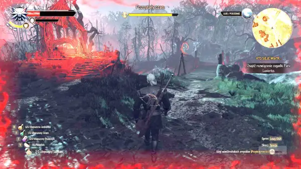 Geralt w rynsztunku szkoły żmii przemierza mroczny las. Czerwone światło otacza ruiny.