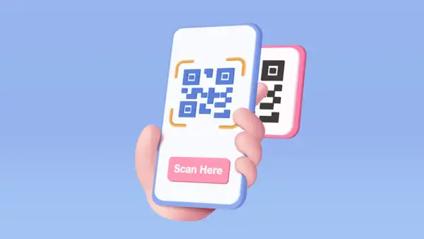 Dłoń trzyma smartfon z kodem QR i przyciskiem "Scan Here". Dowiedz się, jak zeskanować kod QR.