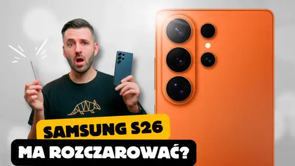 Zaskoczony mężczyzna trzymający rysik obok pomarańczowego Samsung Galaxy S26. Czy nowy model rozczaruje?