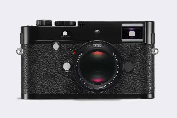 A classic black Leica 240 camera with a Summilux-M 50mm f/1.4 ASPH lens. This iconic camera is ready to capture timeless moments.