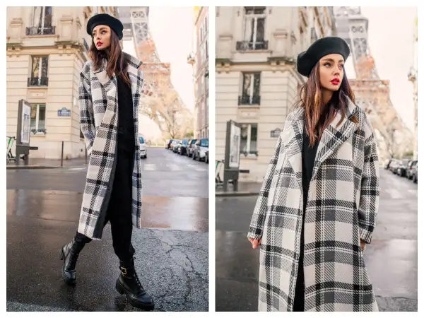 Elegancki płaszczyk plus size w kratę, idealny na paryski spacer. Kobieta w beretce i długim płaszczu na tle Wieży Eiffla.