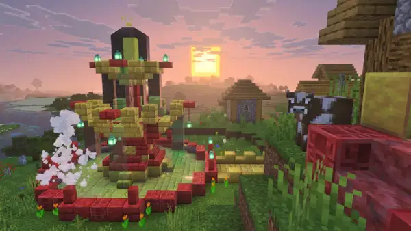 Wioska w Minecraft z nową aktualizacją. W centrum budowla z czerwonych i złotych bloków, obok krowa i domki.