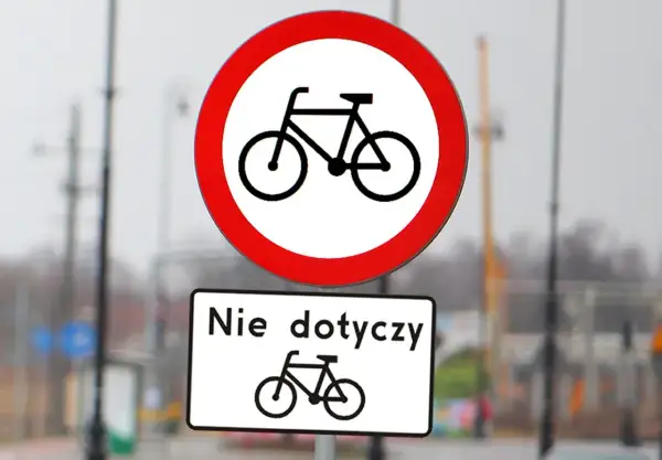Dwa znaki drogowe: okrągły z rowerem i przekreślonym, oraz prostokątny z napisem "Nie dotyczy" i rowerem. Różne rodzaje znaków informują o zakazie ruchu rowerowego.