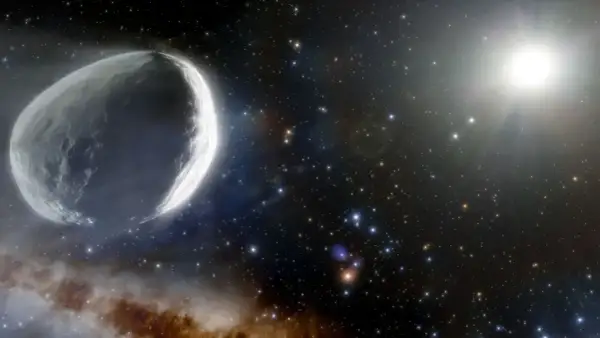 Un gros poisson comète taille adulte, illuminé par le soleil, traverse un champ d'étoiles et de nébuleuses.