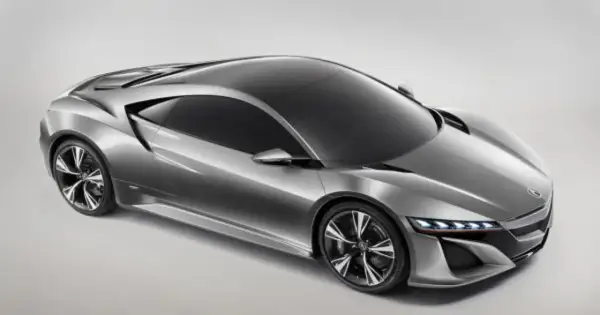 Srebrny, futurystyczny Honda NSX z ostrymi liniami i sportowymi felgami, gotowy do podboju dróg.