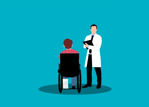 Medico con cartella parla con paziente su sedia a rotelle. Valutazione per la percentuale invalidità per esenzione ticket.