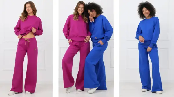 Trzy kobiety prezentują zestawy dresowe w kolorach fuksji i kobaltu. To kwintesencja sportowej elegancji, idealnej na co dzień.