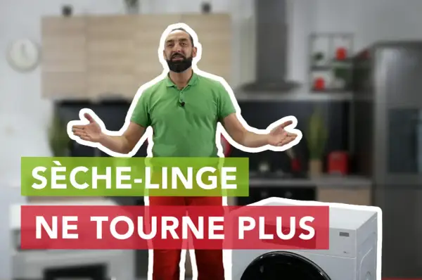 Un homme explique pourquoi son sèche-linge ne tourne plus, devant un appareil et une cuisine floue.
