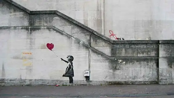 Banksy art piece: Girl letting go of a red heart balloon, with the words "THERE IS ALWAYS HOPE" stenciled above.