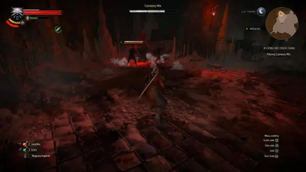 Wiedźmin 3 w cieniu wiecznego ognia. Geralt walczy z Ofiarą zarazy w jaskini, otoczony czerwonym światłem i stalaktytami.