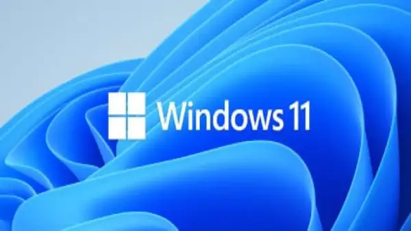 Logo de Windows 11 sobre fondo azul ondulado. Averigua cuanto cuesta instalar Windows 11 y renueva tu sistema.