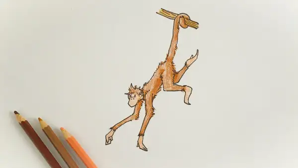 Dibujo de un mono naranja colgado de una rama, con lápices de colores al lado.