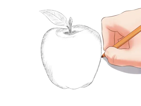 Mano dibujando una manzana con lápiz. Boceto de manzana con hoja, ideal para dibujos de para dibujar.