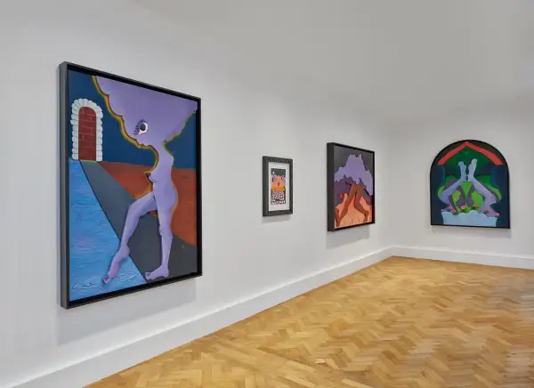 Gallery wall featuring surreal artworks by Alexandria Smith, including a purple figure by a brick archway and abstract forms.