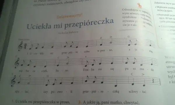 Fragment nut z piosenką "Uciekła mi przepióreczka" z literami i cyframi.