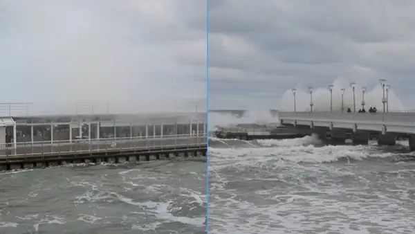 Sztorm na Bałtyku szaleje. Potężne fale rozbijają się o molo i budynek przy plaży.