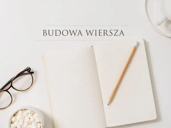 Otwarty notatnik, ołówkiem i okularami, gotowe do nauki budowa wiersza klasa 6.