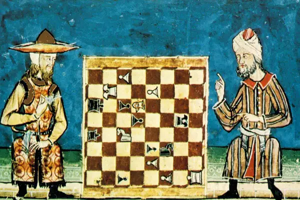 Dos hombres medievales jugando al ajedrez.