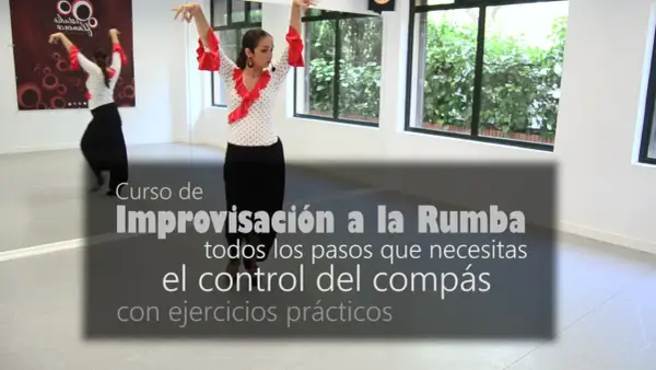 Mujer bailando flamenco con falda negra y blusa de lunares rojos. Aprende el ritmo de rumba flamenca y el control del compás.