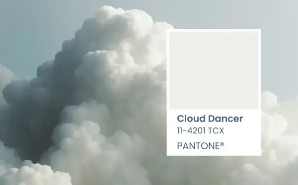 A soft, ethereal cloud formation, reminiscent of a cloud dancer, is paired with the Pantone color swatch for Cloud Dancer 11-4201 TCX.