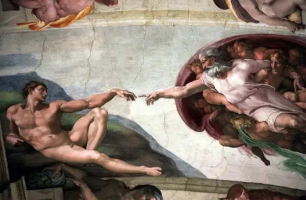 Michelangelo's "The Creation of Adam" fresco, showing God's finger reaching to Adam's.