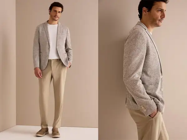 Stilvolles hochzeitsgast outfit mann: hellgraues Sakko mit Struktur, weißes T-Shirt und beige Chino-Hose. Perfekt für eine elegante Sommerhochzeit.