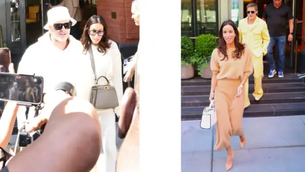 Inés de Ramón, con un conjunto beige, camina sonriente mientras Brad Pitt, con un llamativo traje amarillo, desciende escaleras.