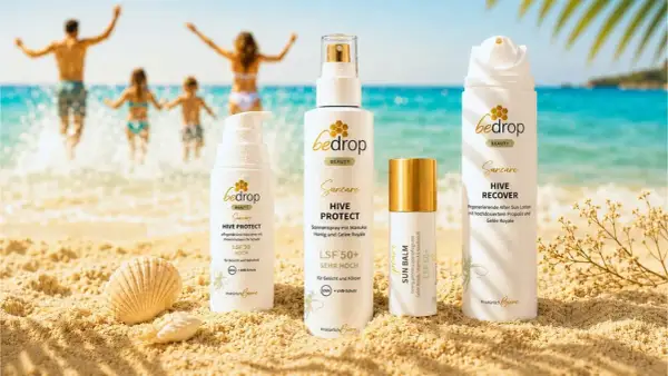 Strandtag mit Familie und bedrop Suncare Produkten. Sonnenschutz mit Sheabutter schützt die Haut.