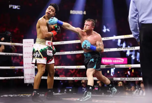 Canelo lands a powerful punch, showcasing his boxing prowess and adding to his list of accomplishments in the ring.
