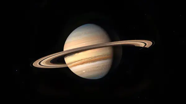 Saturnus med sina ringar, en majestätisk syn som ger en uppfattning om planetens enorma diameter.